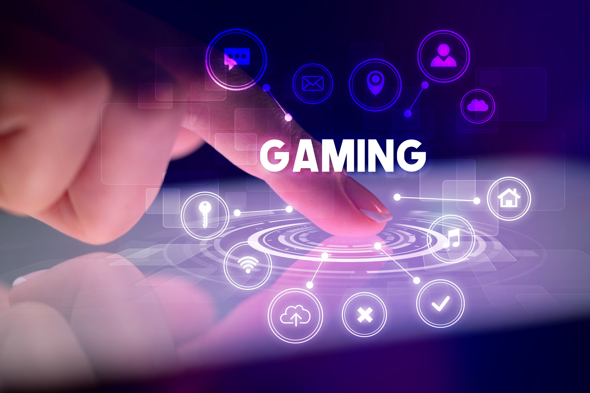 Finger touching tablet with web technology icons and GAMING inscription, web technology concept